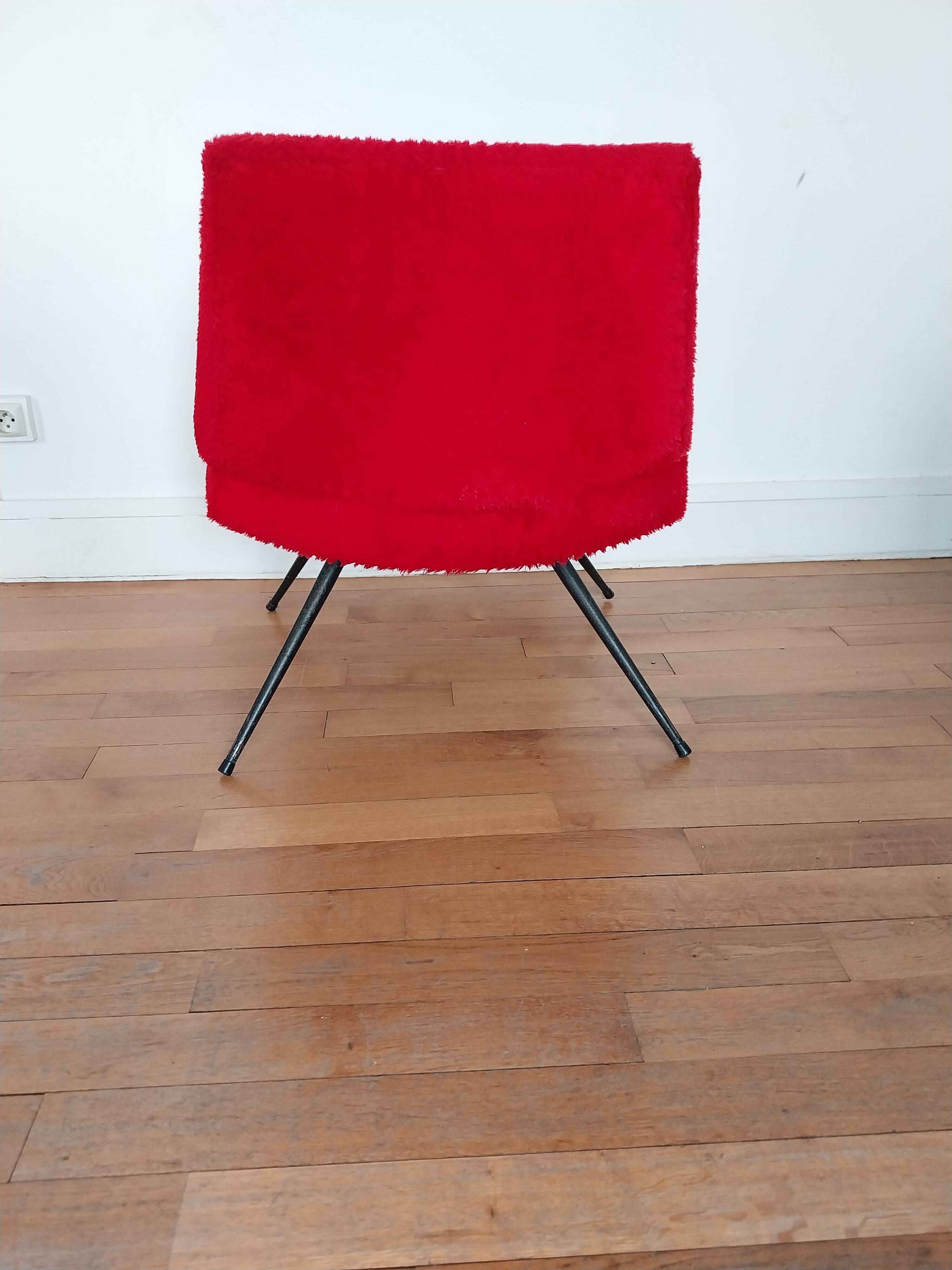 Vintage red faux fur armchair with black metal legs.