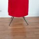 Vintage red faux fur armchair with black metal legs.