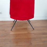 Vintage red faux fur armchair with black metal legs.
