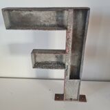 Letter F in vintage iron
