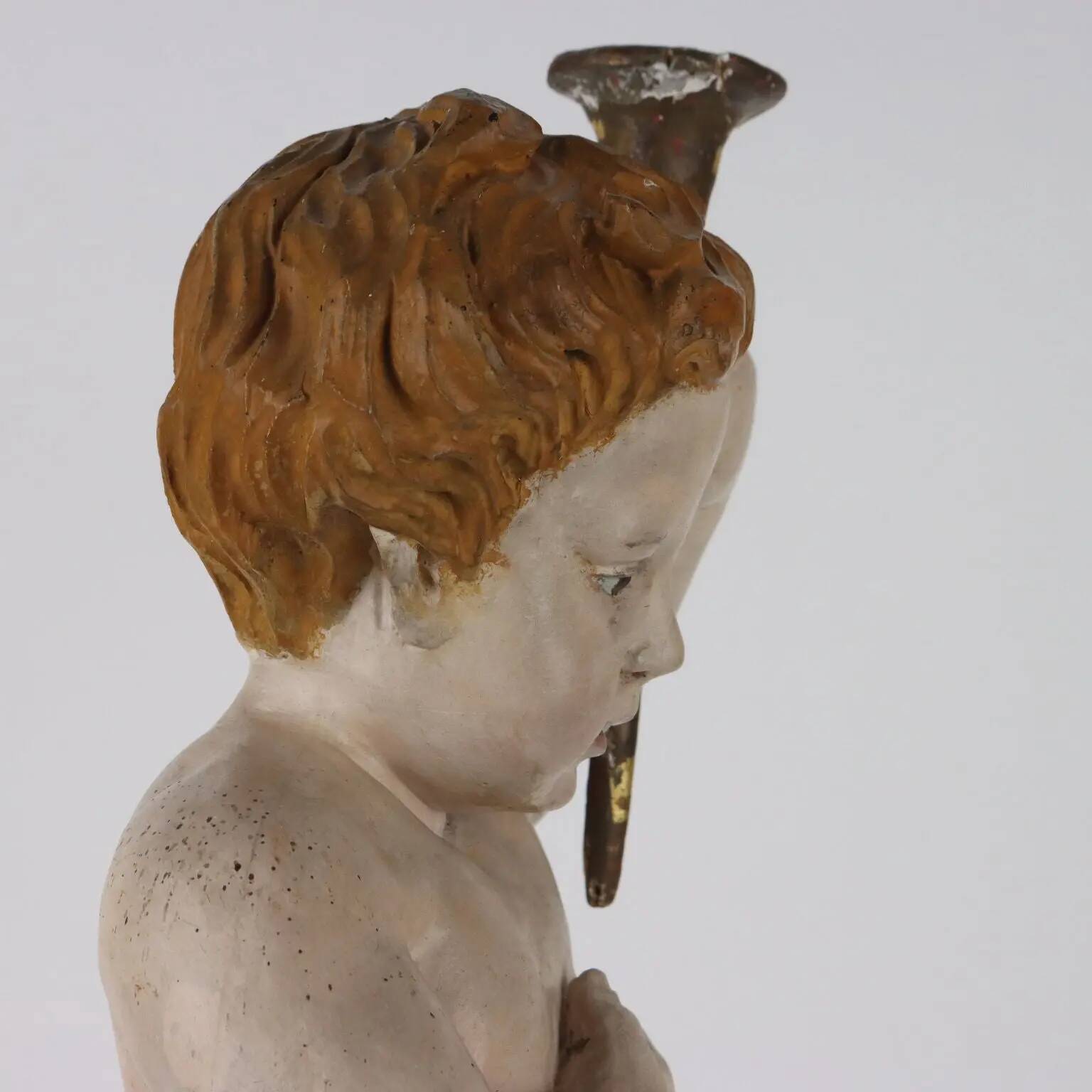 Ancient sculpture of a putto in carved and gilded wood, Italy, 19th century.