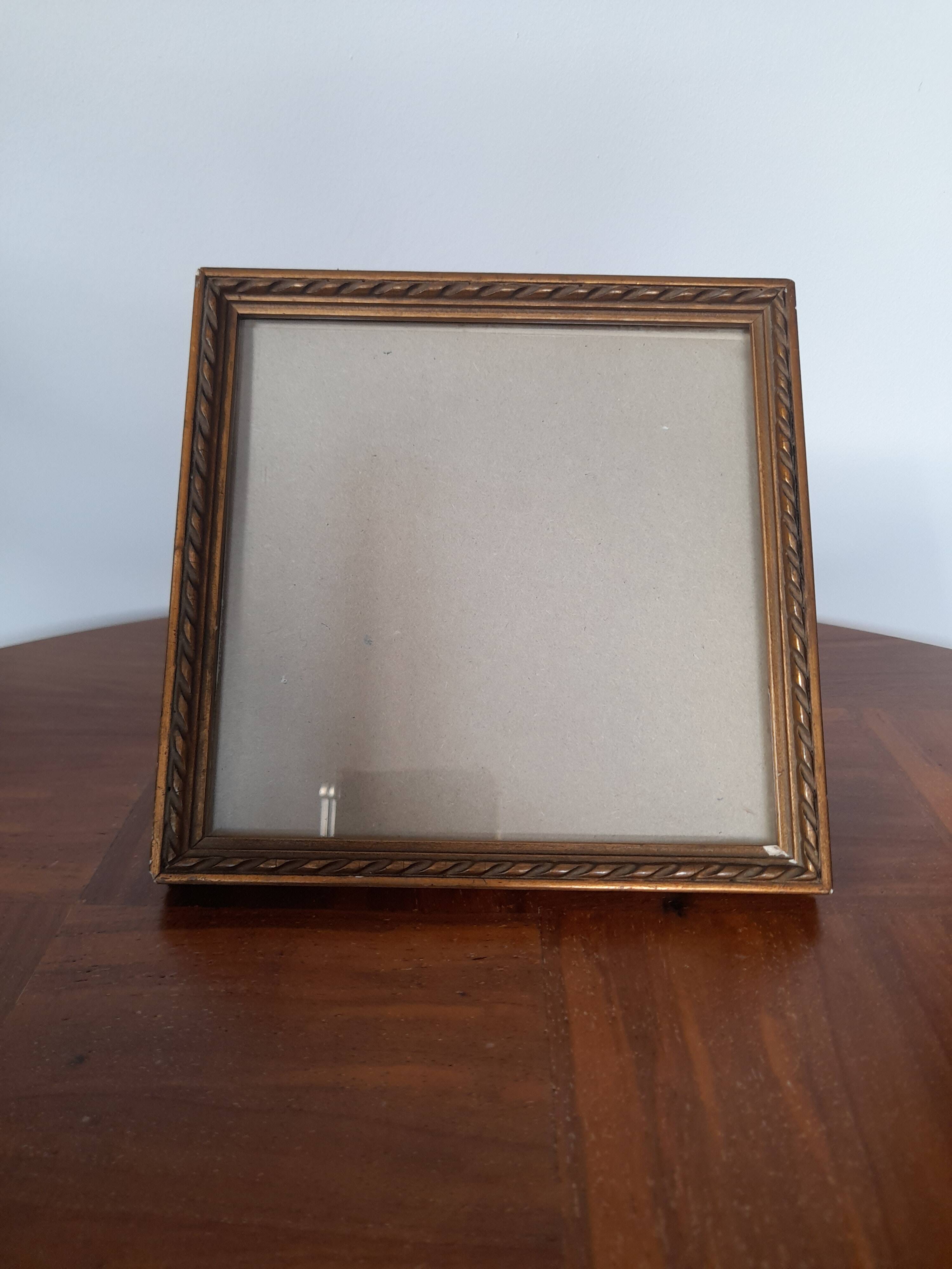 Old square golden frame to place or hang