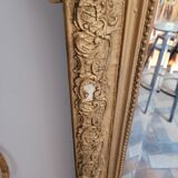 Old gilded mirror with pediment