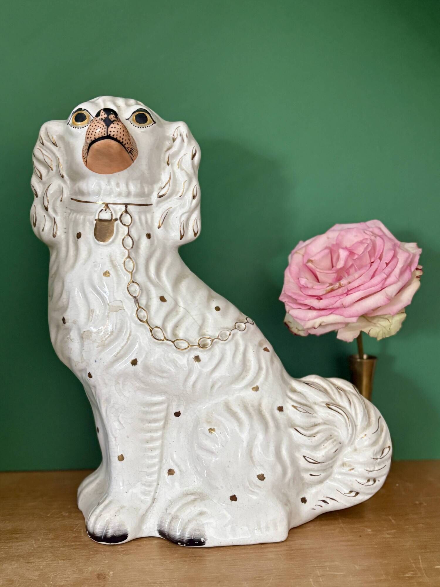 Pair of Staffordshire-type dogs in white and gold ceramic