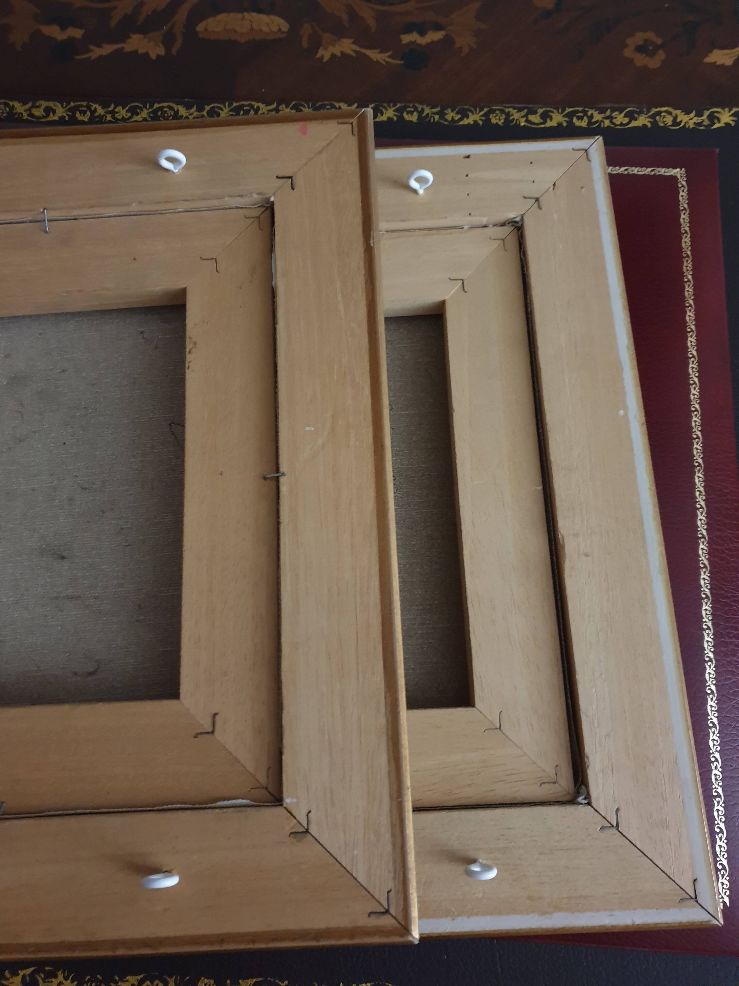 Set of two paintings with identical gold and silver frames