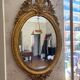 Golden oval mirror