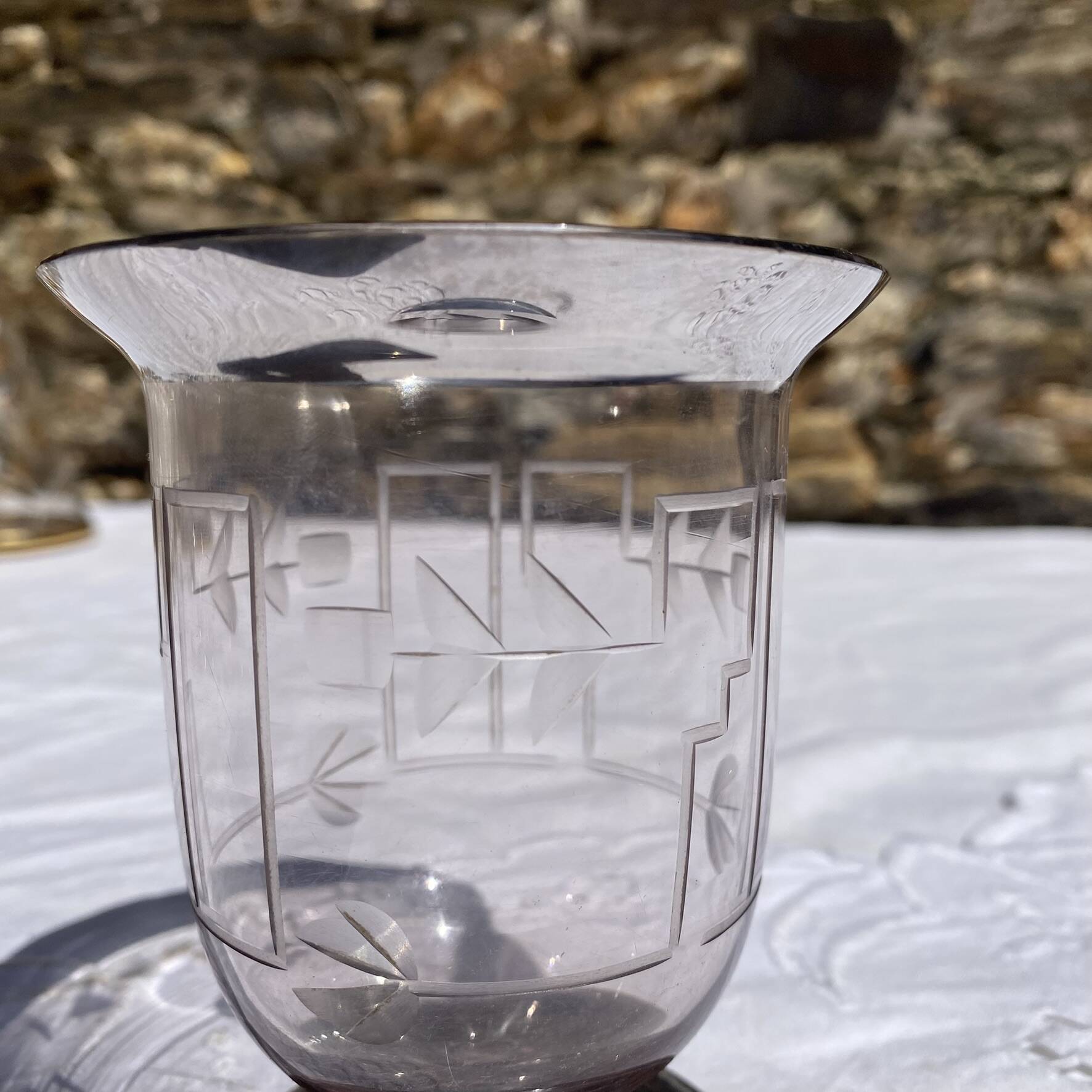 Antique Art Deco engraved glass, silvered rim and base.