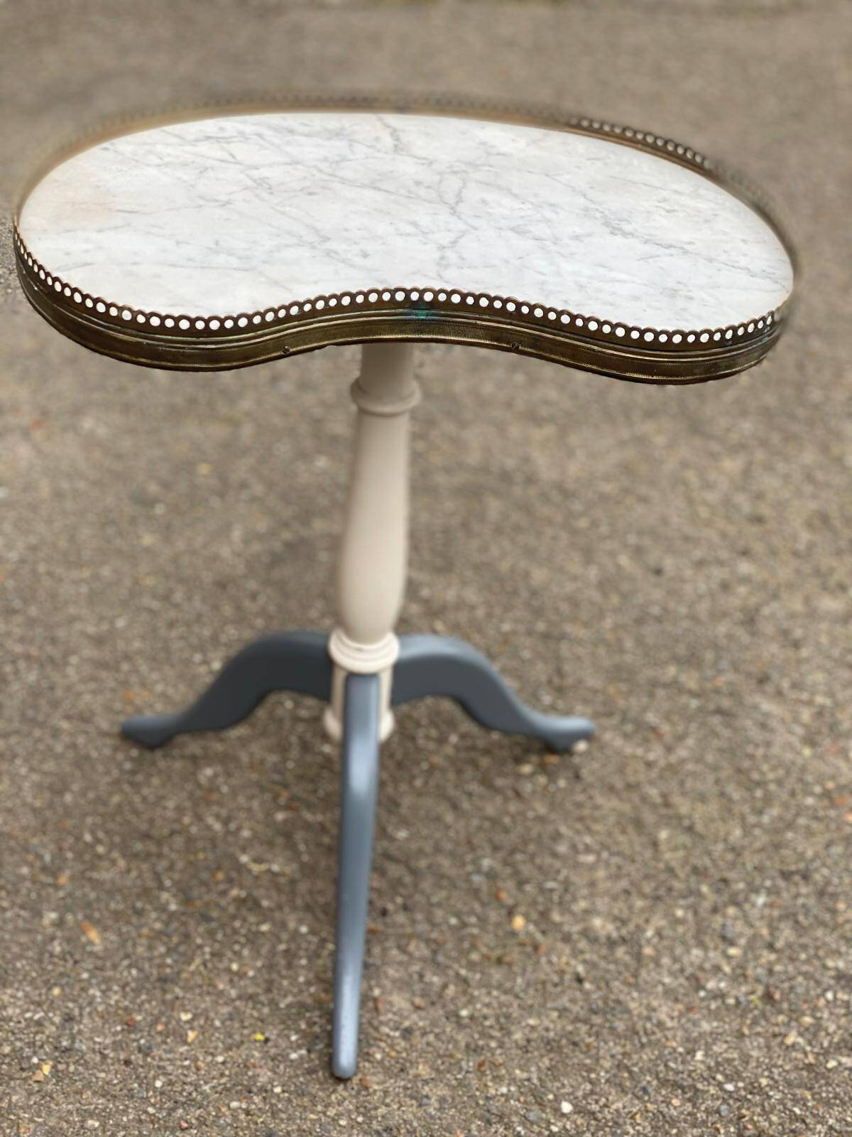 Pair of marble and ivory tripod pedestal tables