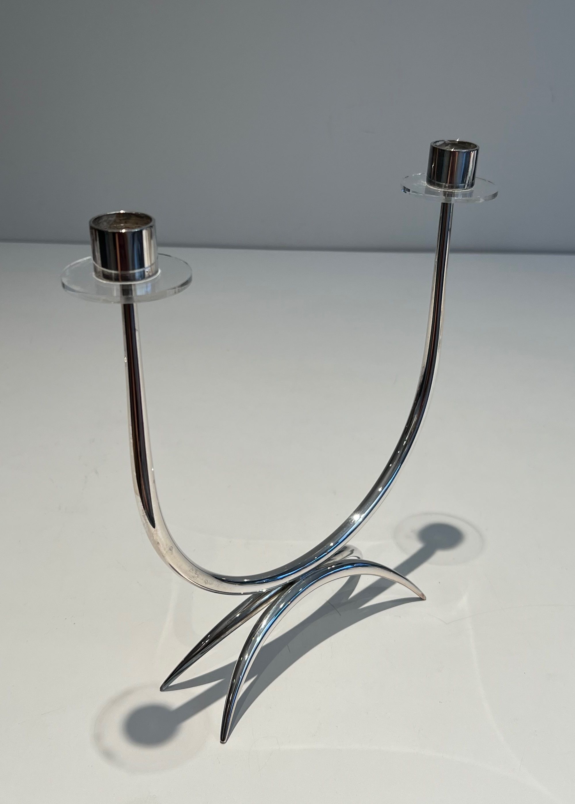 Silver-plated metal and plexiglass design candlestick.