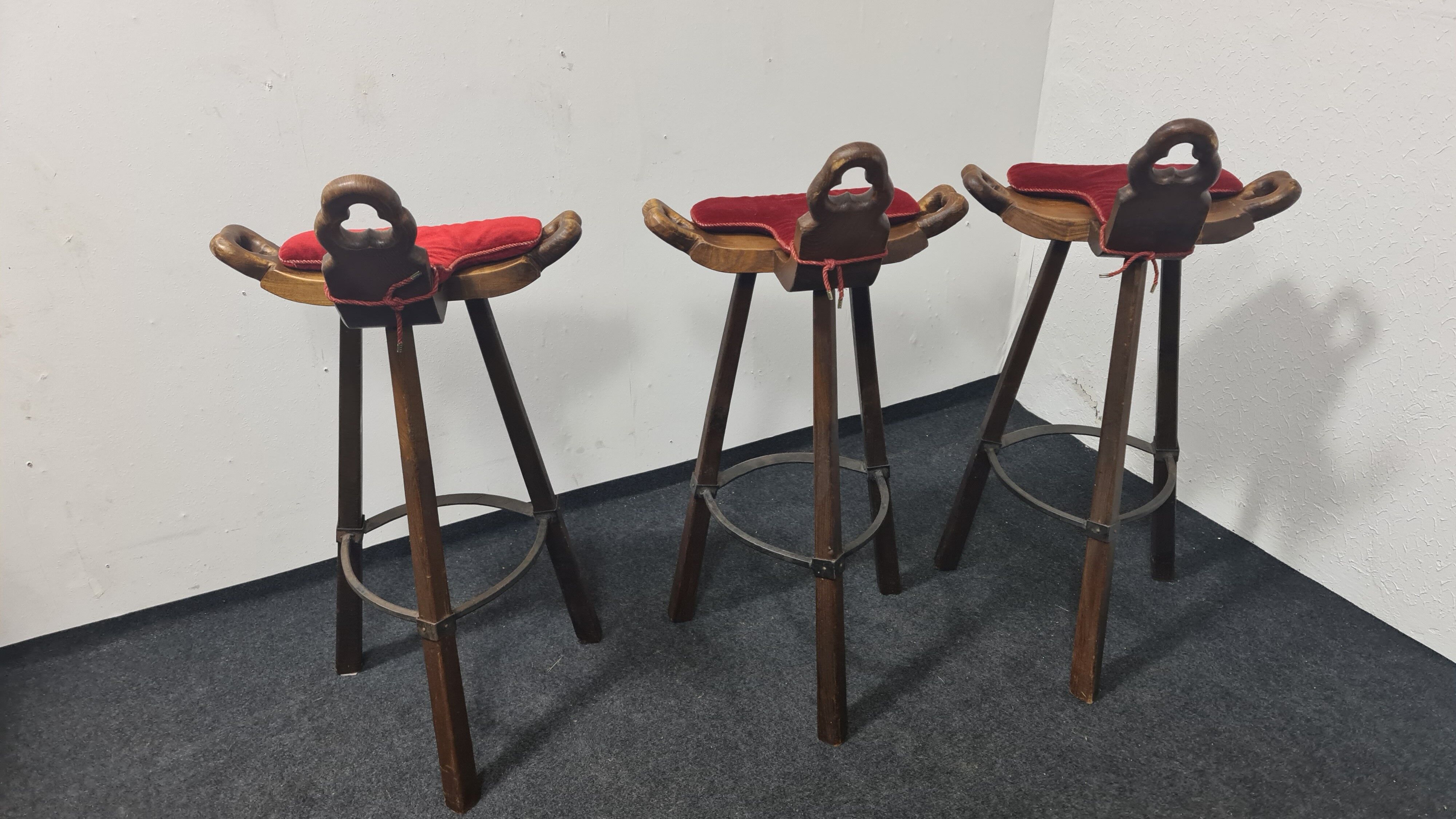 Three vintage Spanish bar stools