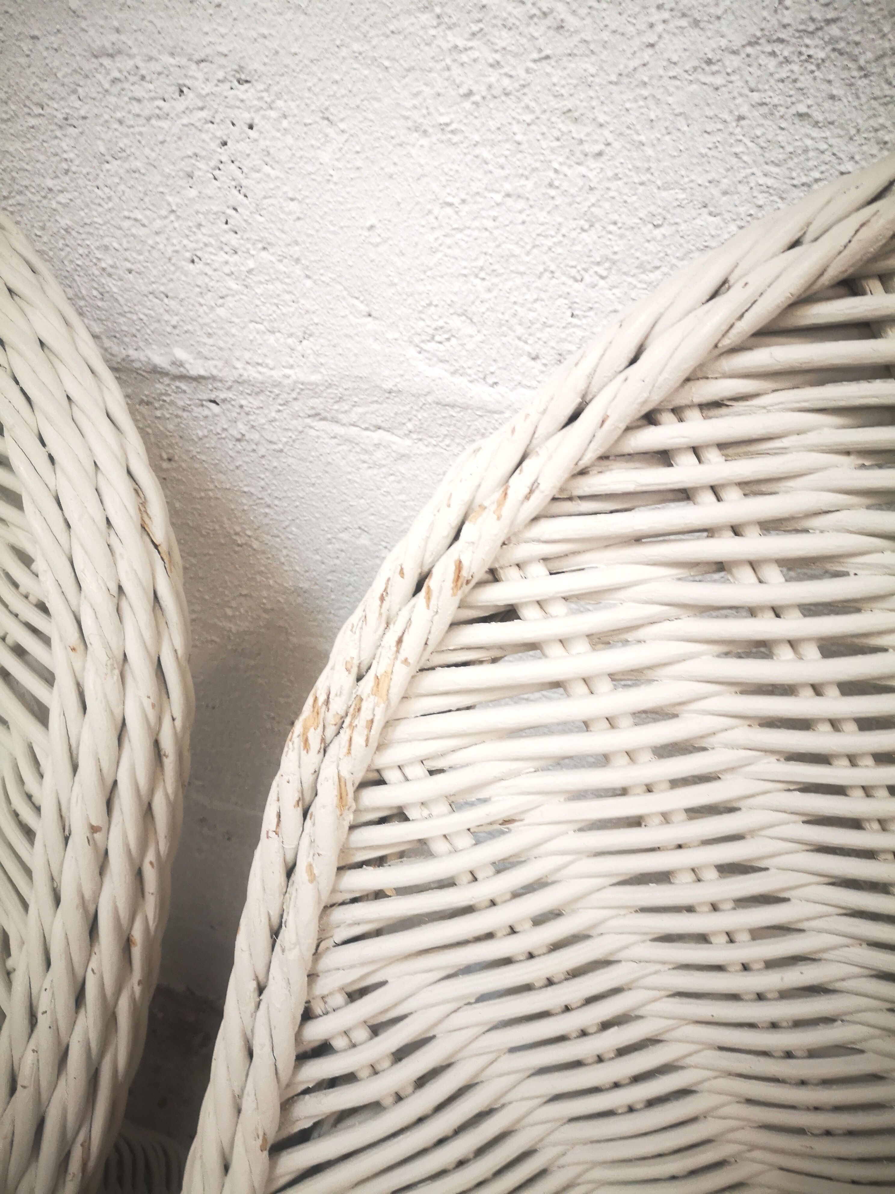 Pair of white rattan armchairs