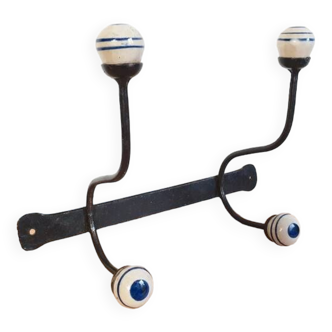 Old wrought iron and ceramic hooks