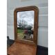 19th-century fireplace mirror in gilded wood and stucco.