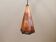 Older Danish cone-shaped hanging lamp in copper-colored lacquer with an inner contrasting shade.