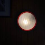 Round glass wall-mounted ceiling light porthole Prisma model Eko red.