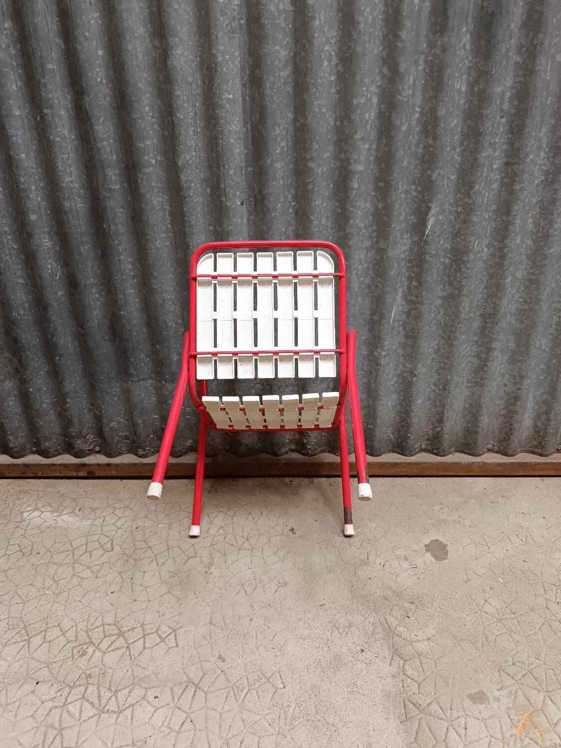 Red metal children's garden armchair