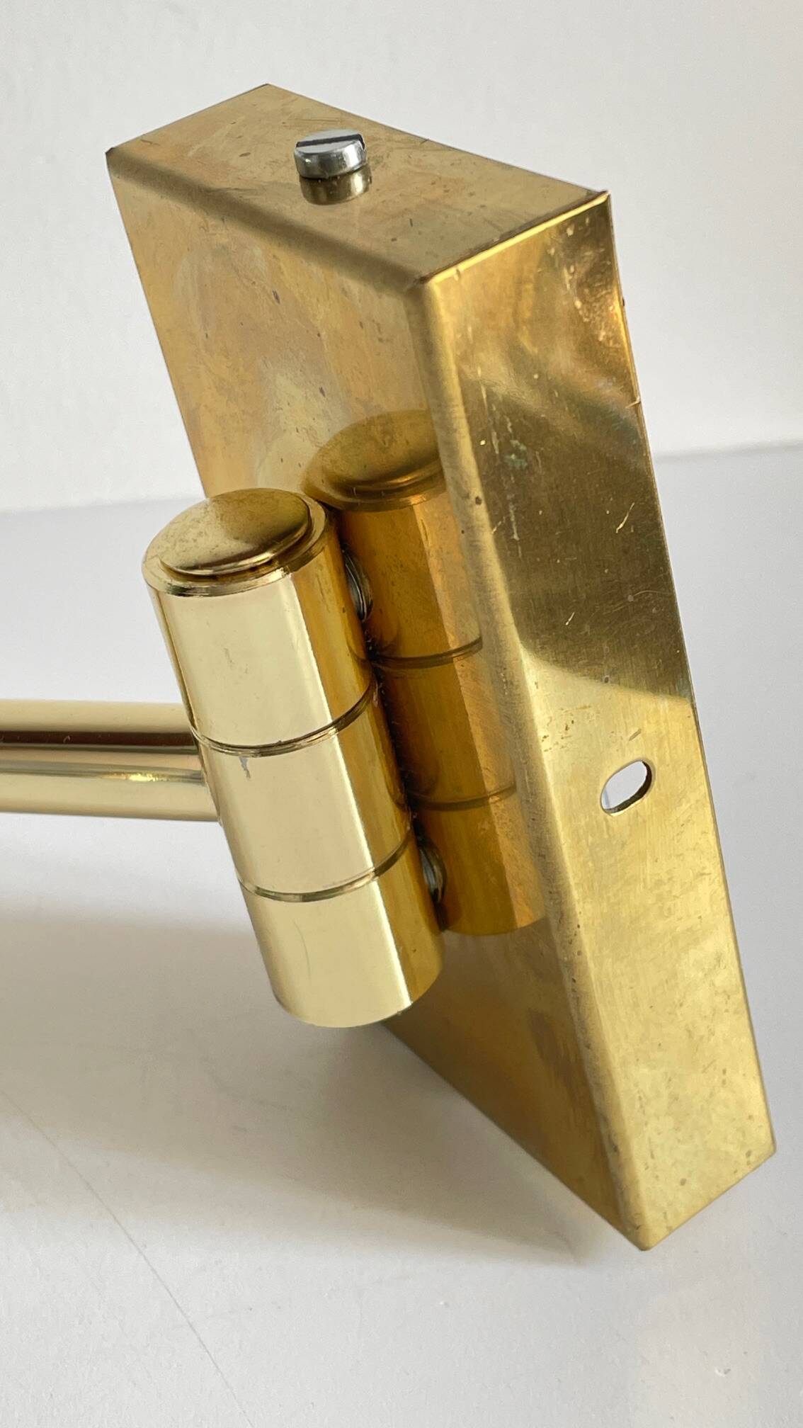 articulated brass and velvet wall light