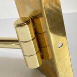 articulated brass and velvet wall light