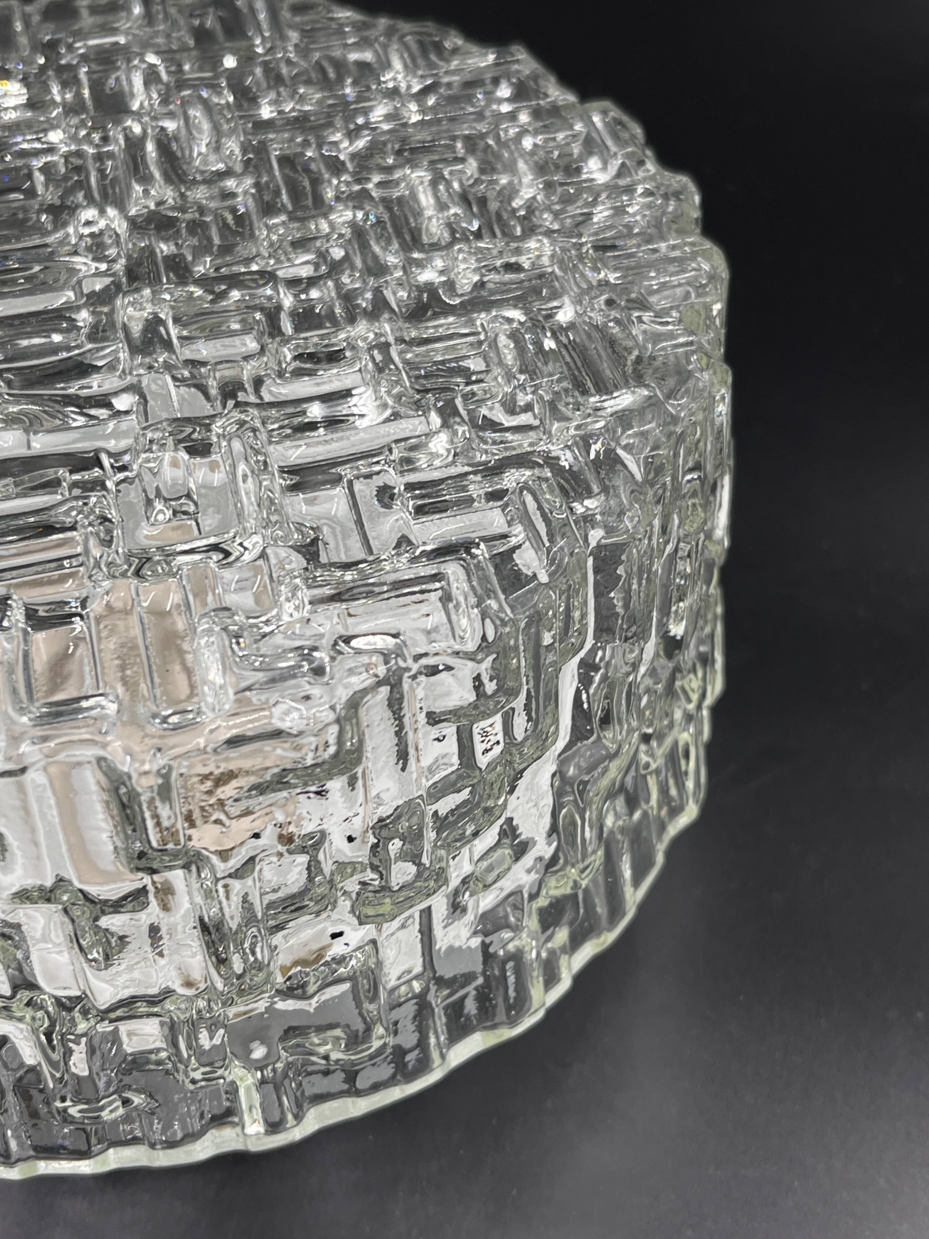 Molded glass ceiling light with relief