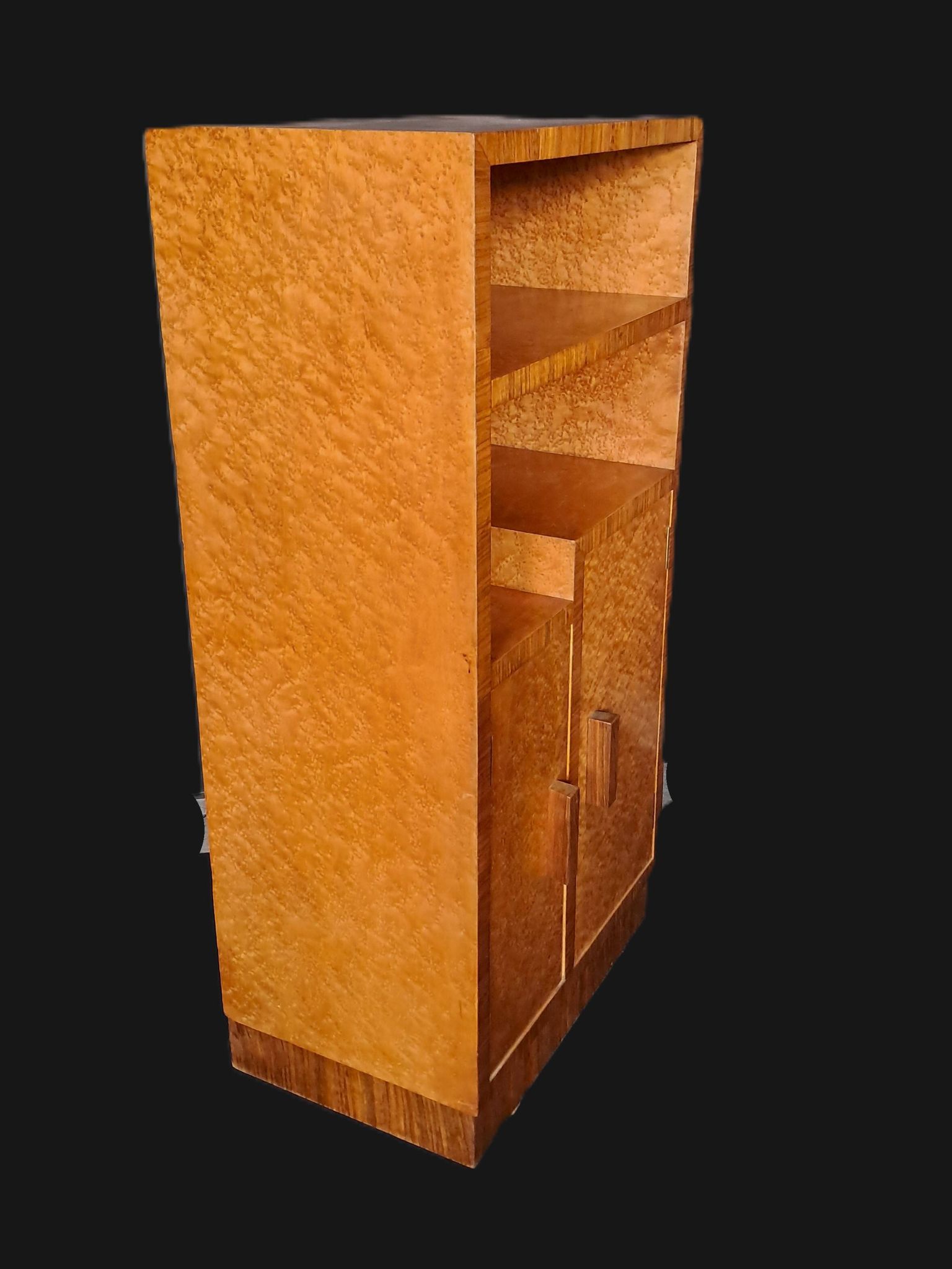 Art Deco cabinet in speckled maple veneer with asymmetrical shelves.
