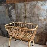 Rattan cradle with arrow