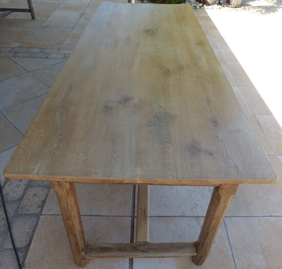 Large honey-colored farmhouse table in solid oak