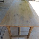 Large honey-colored farmhouse table in solid oak