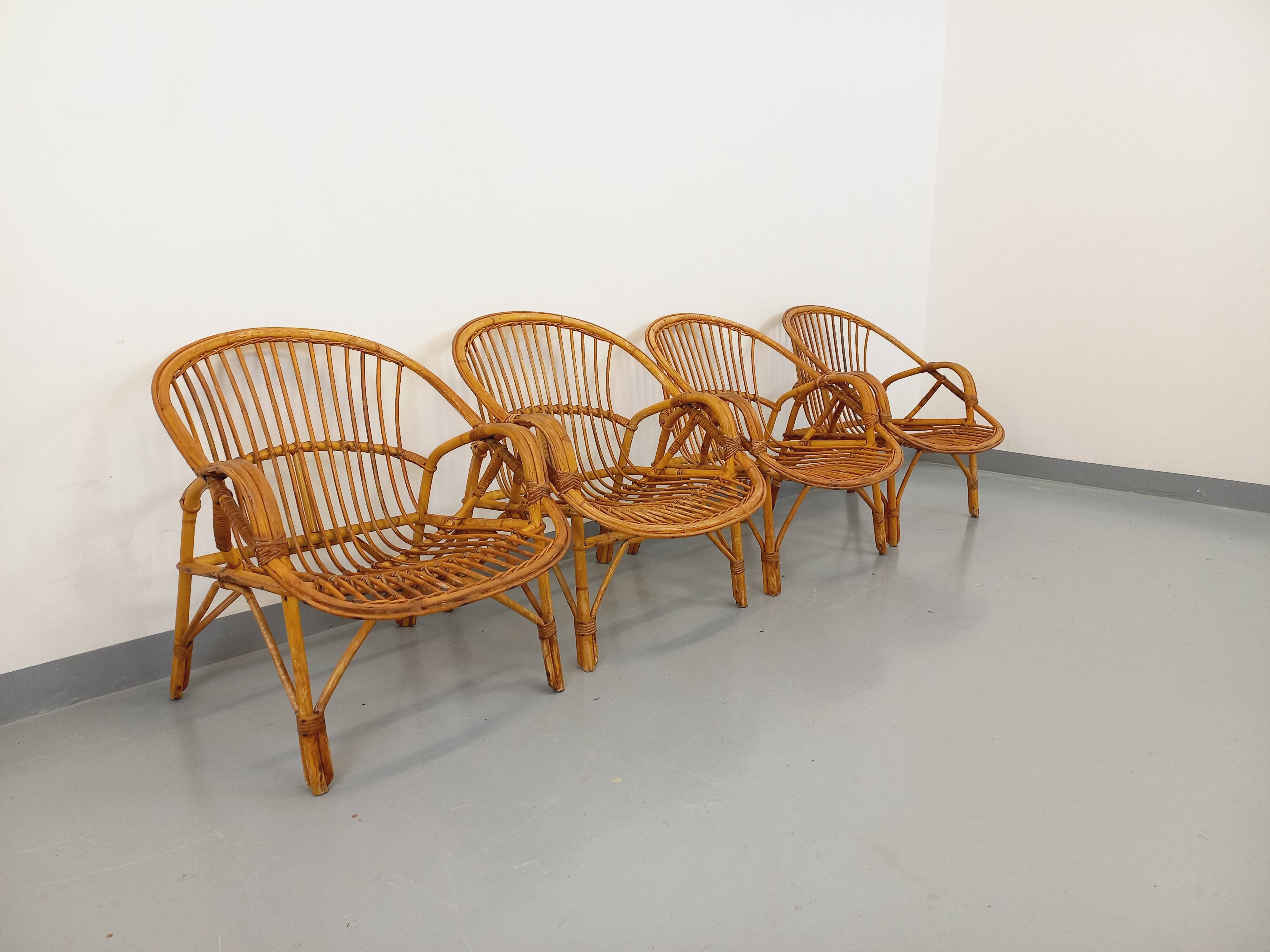 Set of 4 vintage rattan armchairs from the 60s