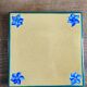 Yellow glazed ceramic trivet signed l. drimmer