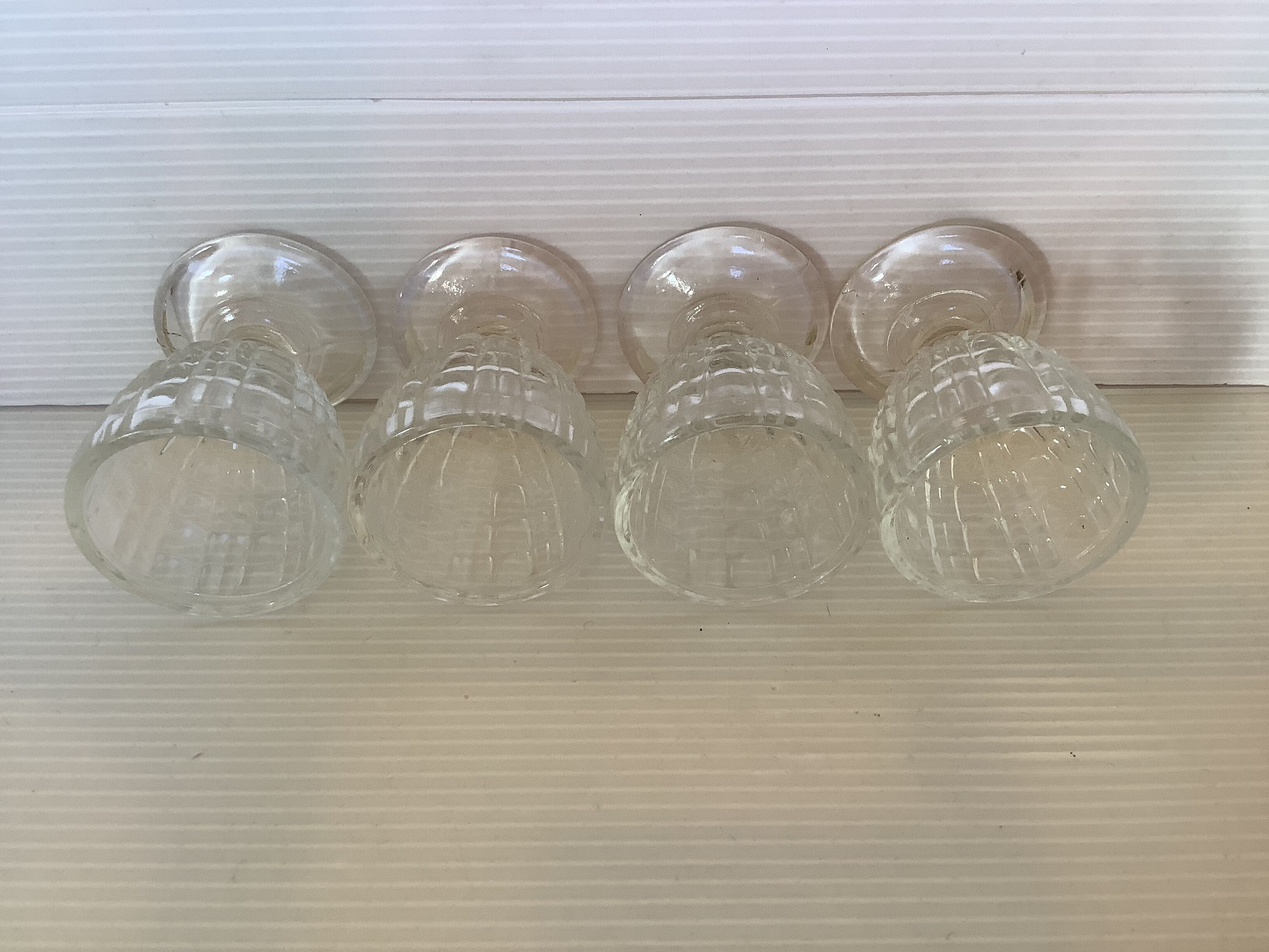 Four old molded glass shells