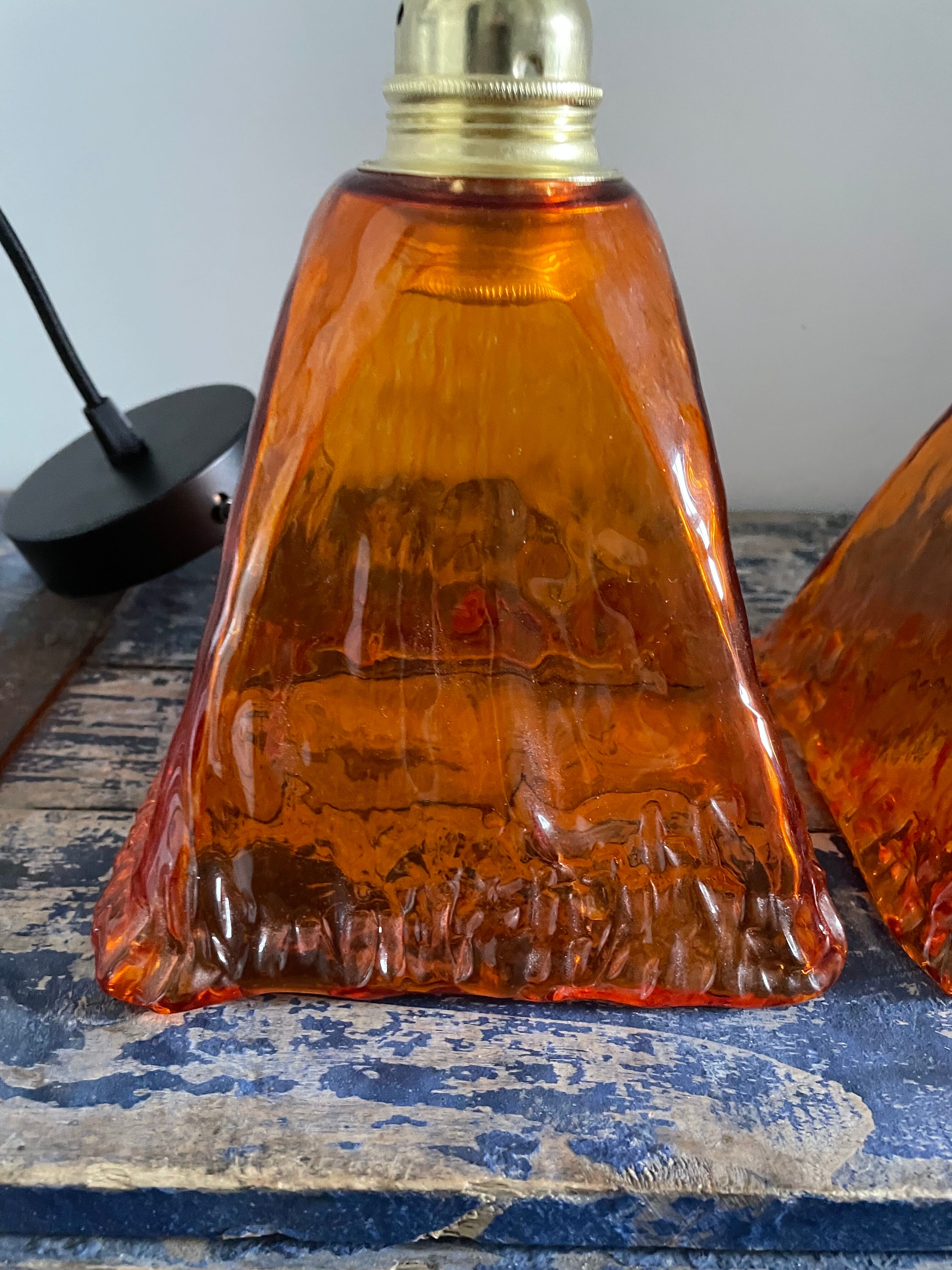 Set of two amber glass hanging lamps