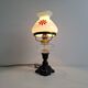 1960s Czechoslovakian milk glass oil lamp style table lamp with red windmill
