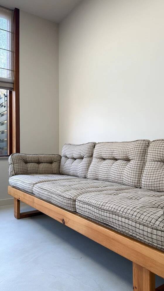 Two vintage Swedish sofas and a pine table