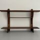 Art Deco wall shelf in wood with three levels, 1940s, Italy.