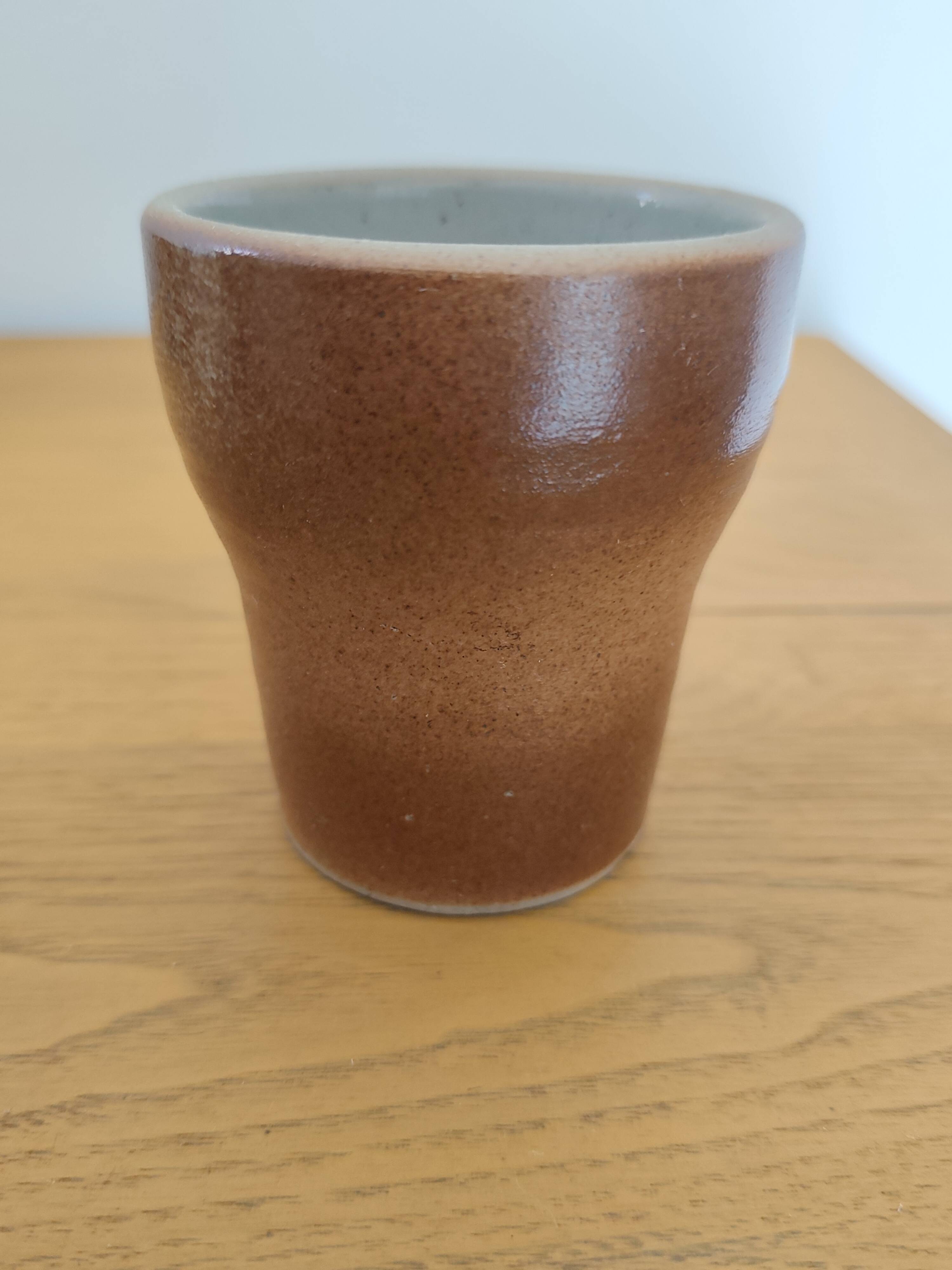 Stoneware cups – Armor stoneware set of 10 and an 11th French stoneware cup.