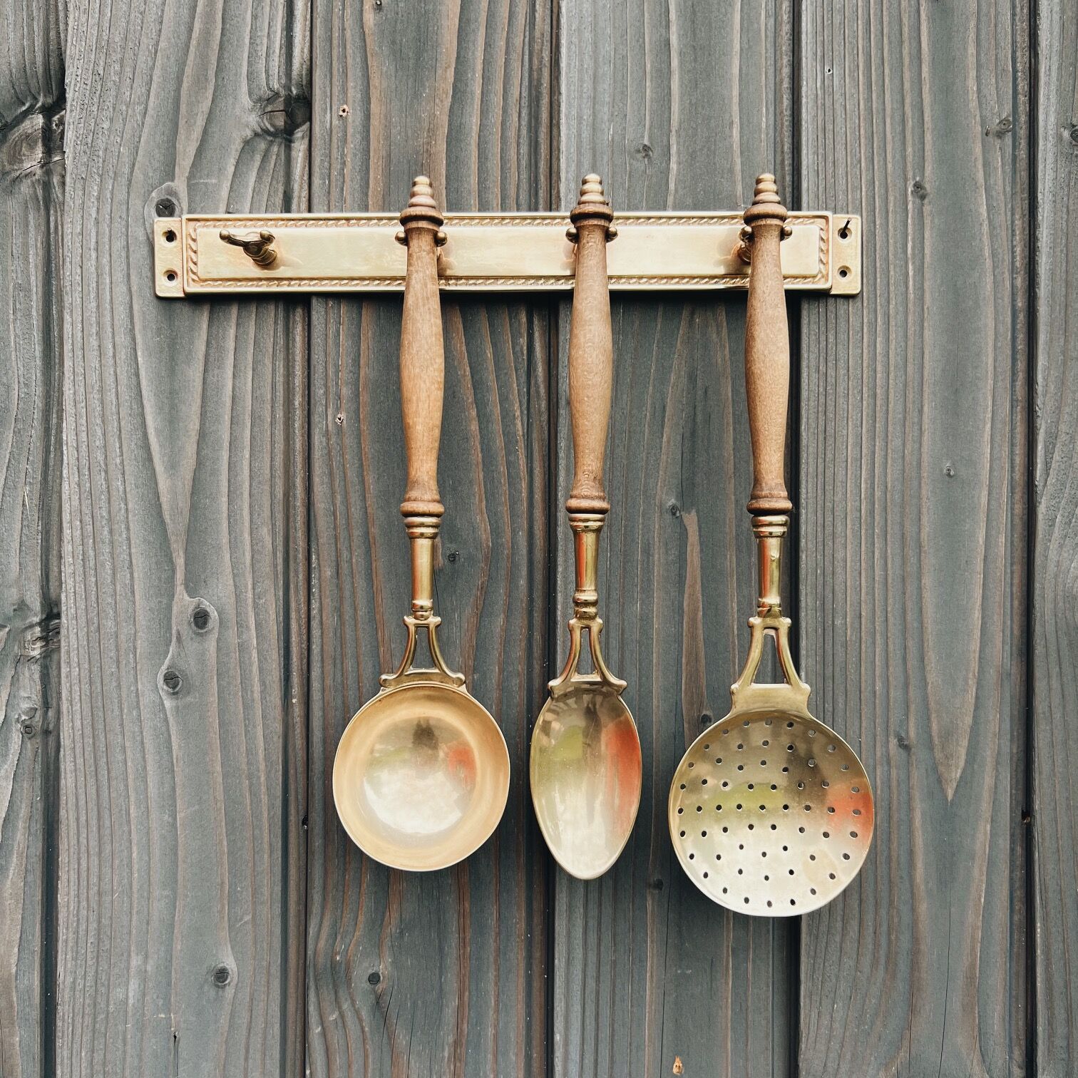 Brass holder with 3 brass & wood utensils