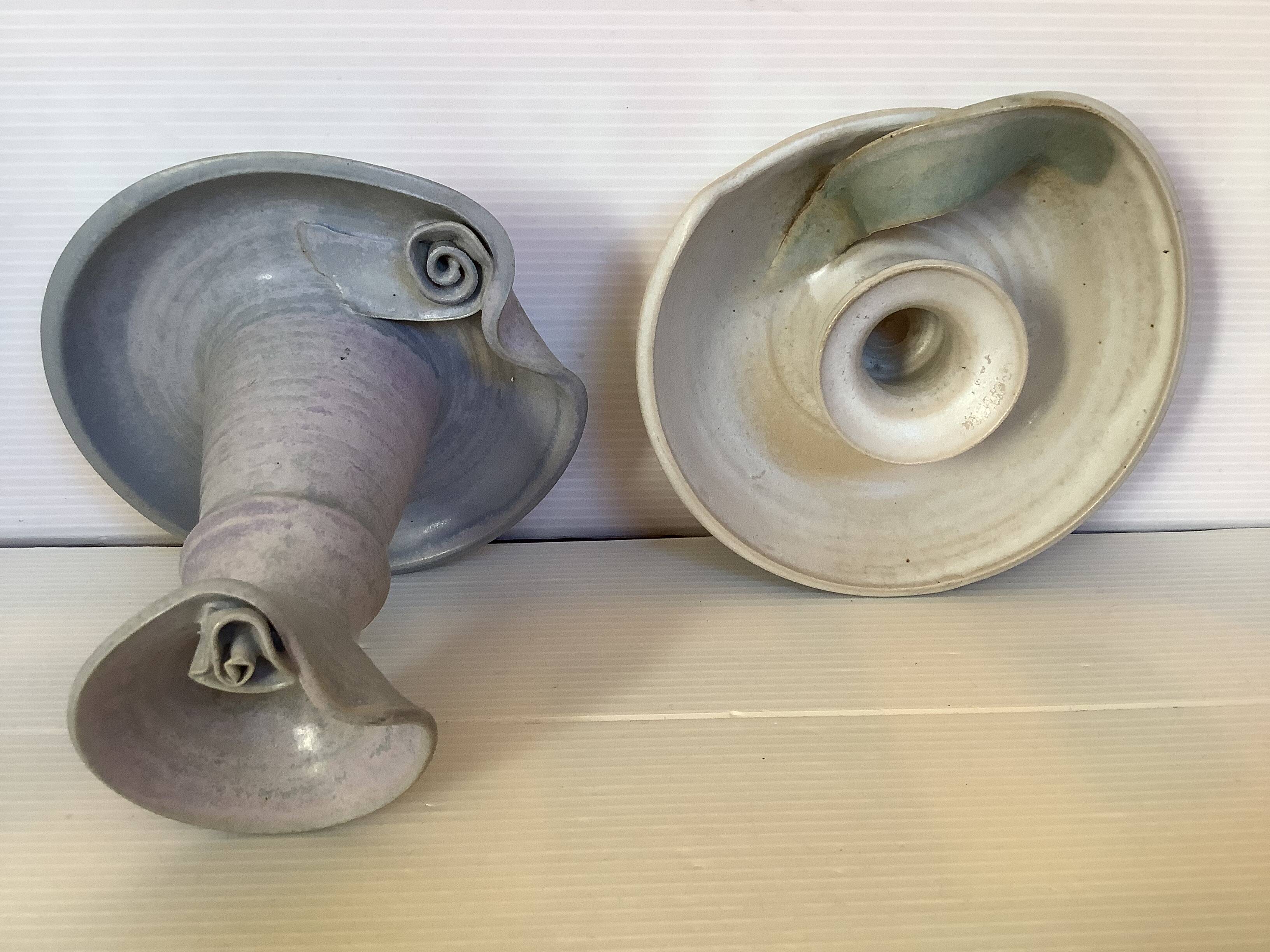 Pair of signed ceramic candlesticks