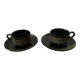 Black cups and saucers with relief decoration