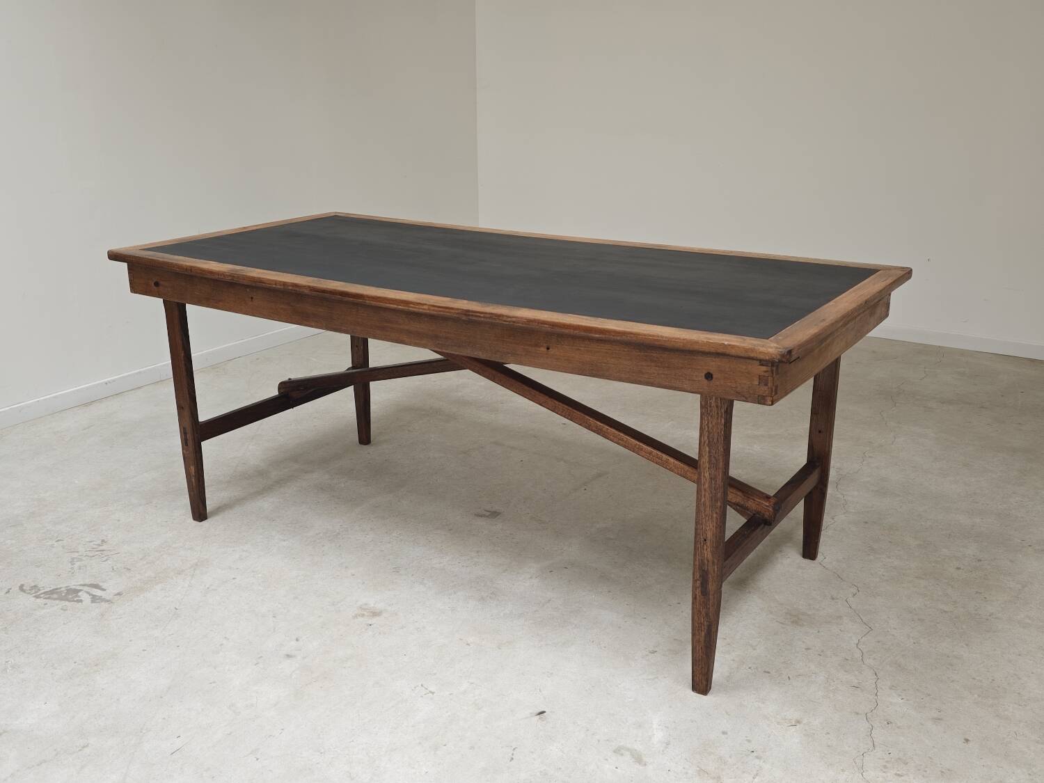 Vintage workshop folding table in oak with a hand-patinated black top.