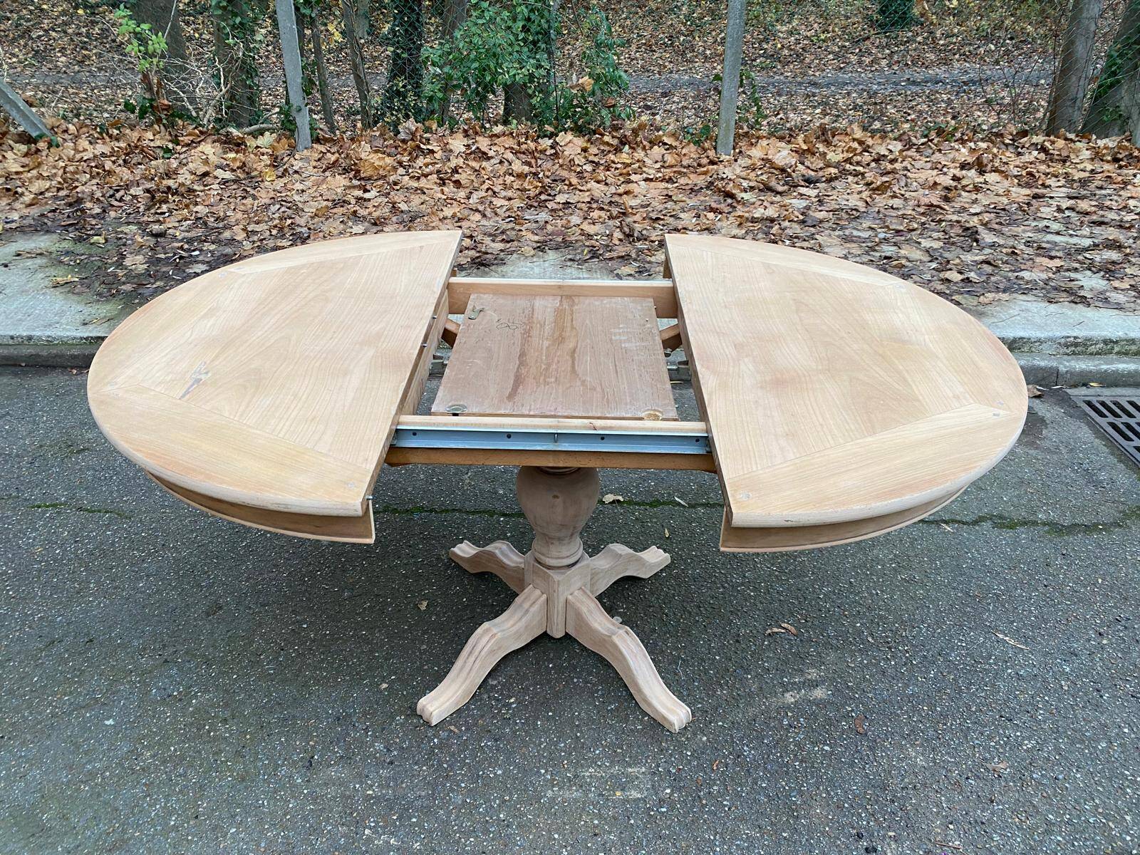 Round extendable dining table with a central pedestal base, renovated in raw wood, 150cm