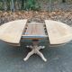 Round extendable dining table with a central pedestal base, renovated in raw wood, 150cm