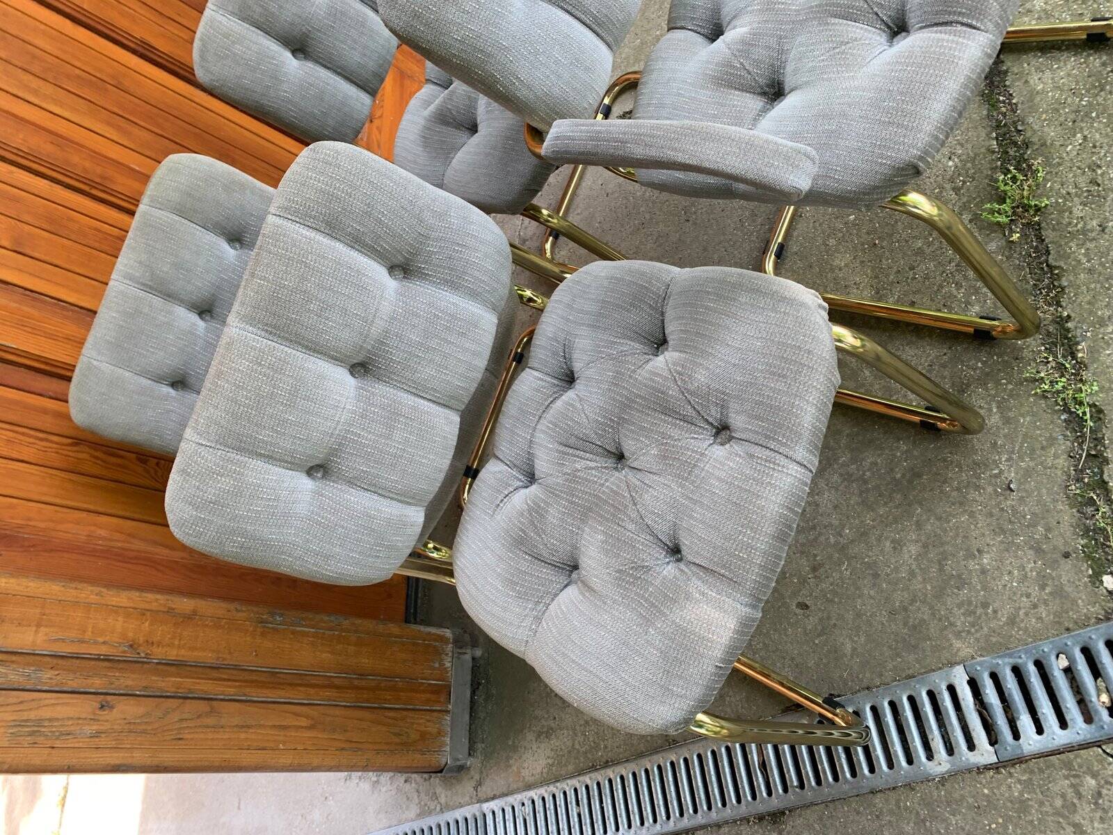 1970s table set with 4 chairs in gold brass and grey fabric, smoked glass top.