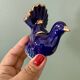 Vintage blue ceramic lamp with its birds.
