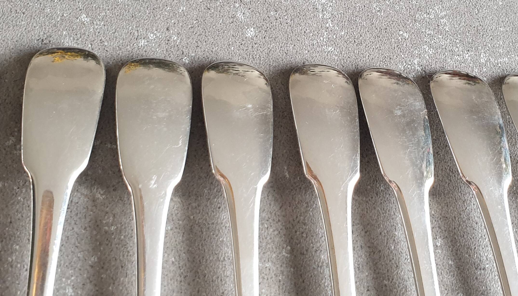 Set of 12 dessert forks and a cake server.