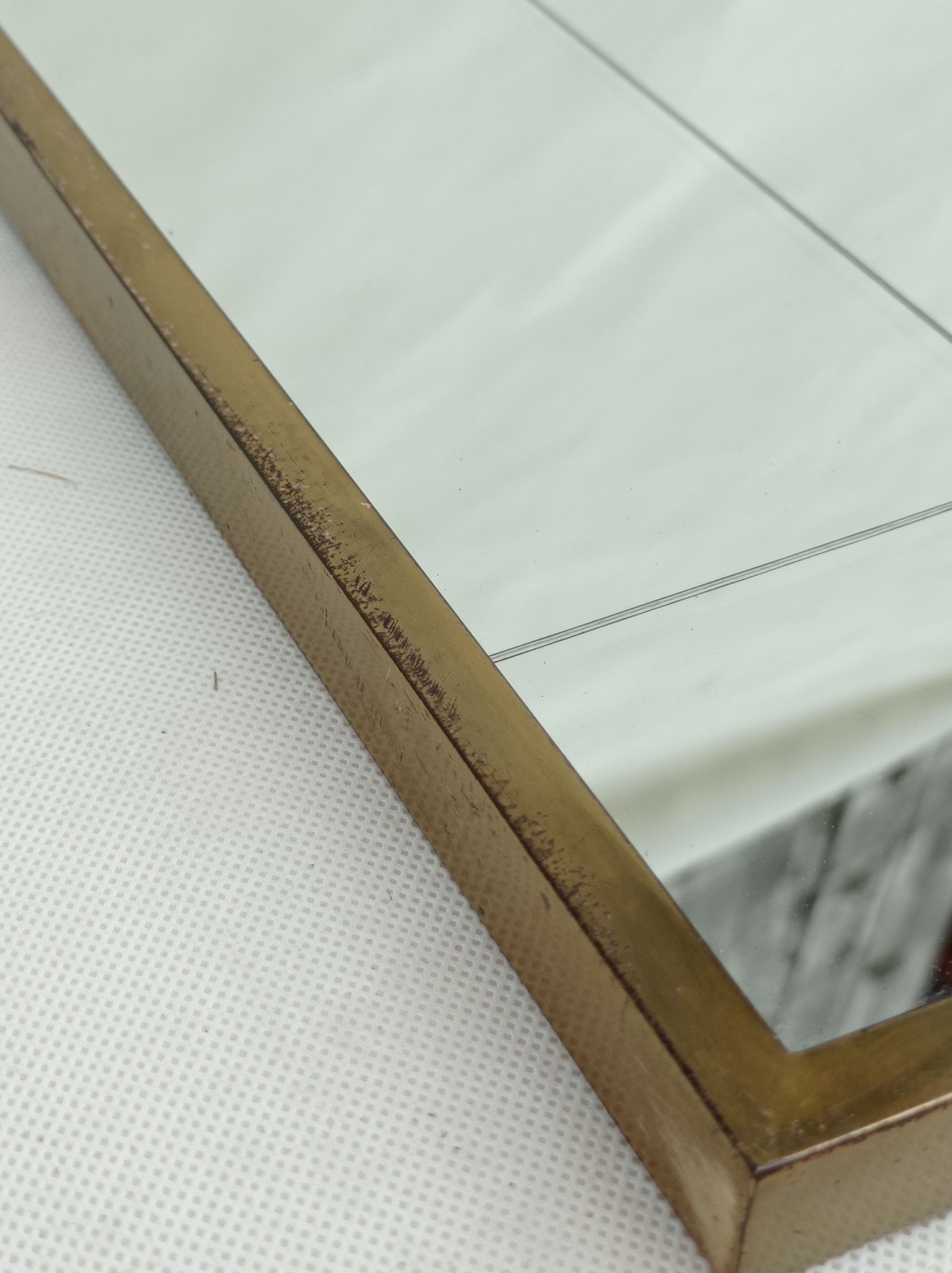 Mirror in a brass frame, dating back to the 1960s