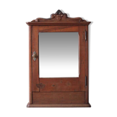 Small wooden antique cabinet with glass door, medicine cabinet, display case, antique furniture, interior decoration.