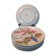 7 sous-tasses, assiettes porcelaine extrafines, décor geisha et paysage japonais, début XXème