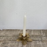 Old golden brass candle holder in the shape of a leaf or flower