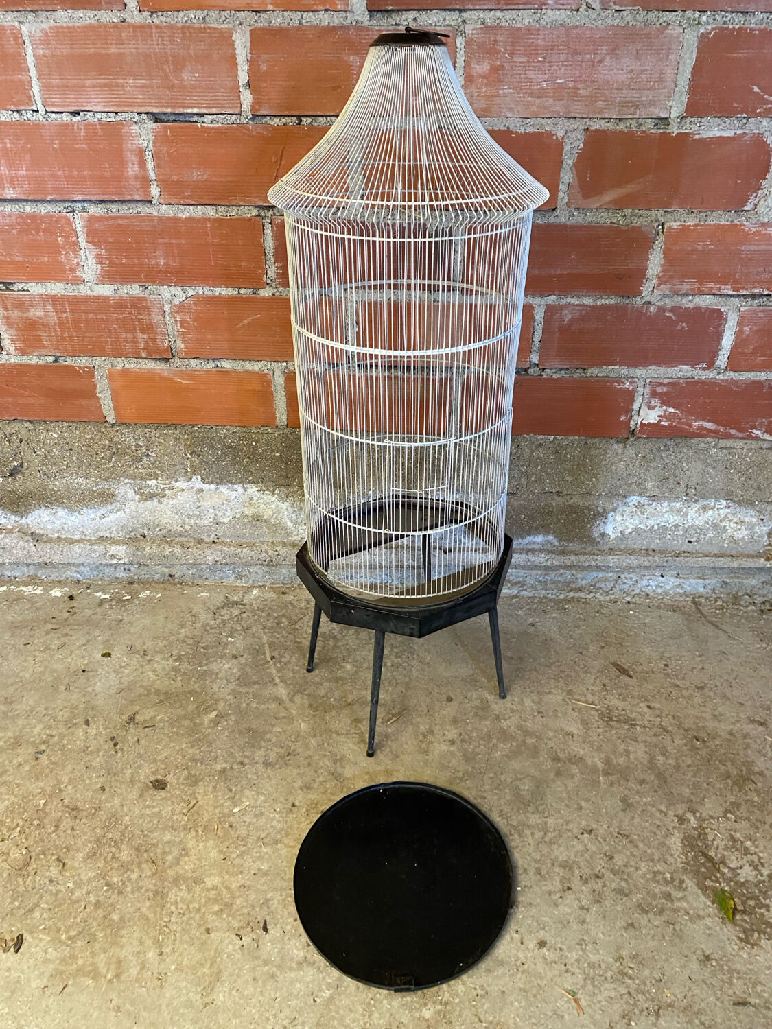 Antique black & white metal bird cage on vintage decorative legs