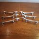 Six silver metal knife holders basset hound